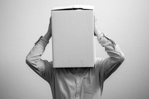 Man with box on head, no awareness